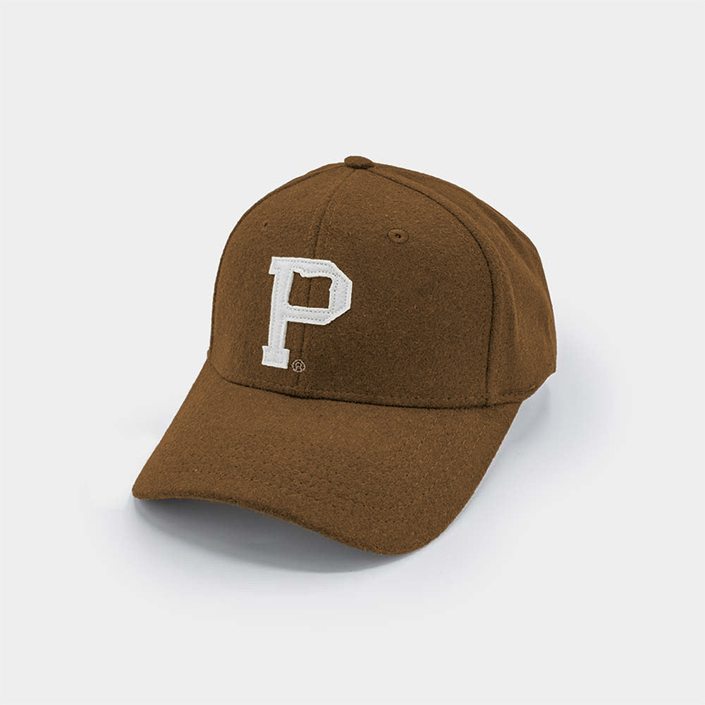 Introducing the Portland "P" Cap - Brown: a stylish brown baseball cap with a curved brim, showcasing the letter "P" elegantly stitched in white on the front panel. This quality cap also features an adjustable back strap and is made from a soft, textured material for added comfort.