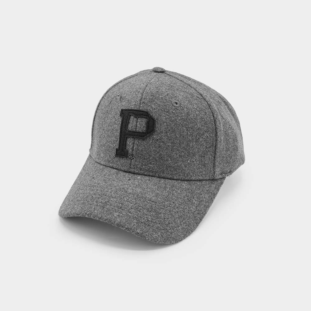The Portland "P" Cap - Classic is a gray baseball cap made from textured fabric, featuring a black embroidered "P" on the front. It has a vintage strap, curved brim, and buttoned top, all showcased against a plain white background.