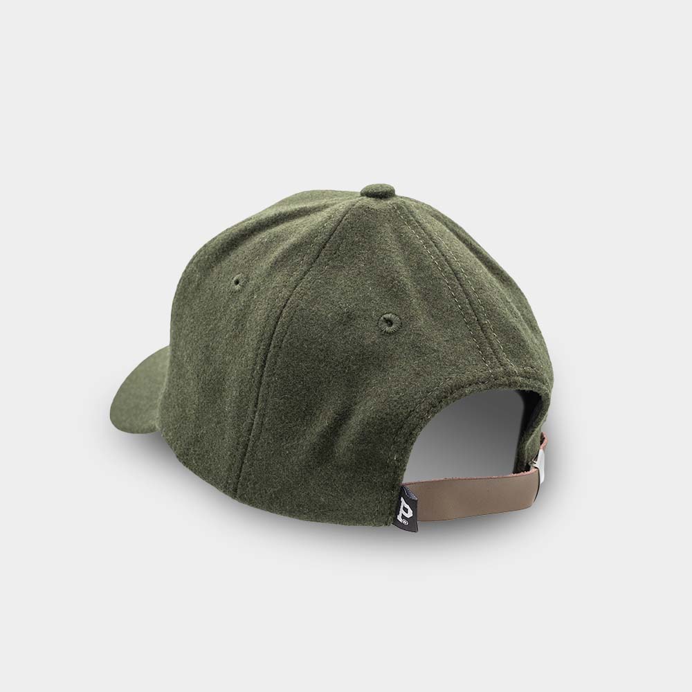 An olive Portland "P" Cap from SHELL PRODUCT, viewed from the back, features a brown adjustable strap with a small black tag at the end. The crown has two ventilation holes. This stylish accessory is set against a plain white background.