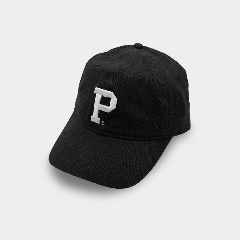 Introducing the Dad Hat - Black: a sleek black baseball cap adorned with a prominent white embroidered letter "P" on the front. This stylish accessory features a curved brim and six panels topped with a button, reminiscent of classic headwear designs. The hat's dark color provides a striking contrast against the light-colored background of the embroidered letter.