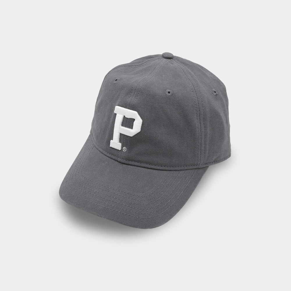 A dark grey Dad Hat with a curved brim, featuring a white letter "P" embroidered on the front. This SHELL PRODUCT has a button on top and appears to be made of a soft fabric. It is displayed against a plain, light grey background.
