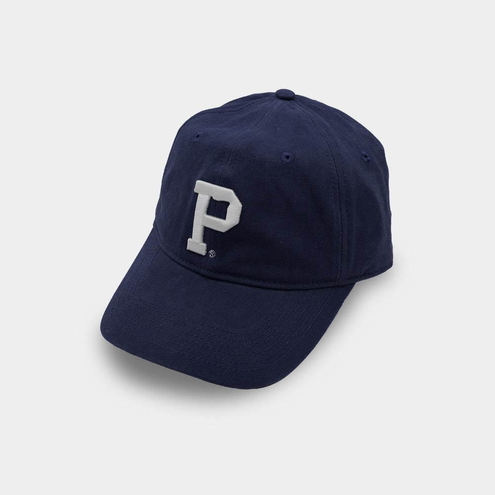 The Dad Hat - Navy, a standout SHELL PRODUCT, features a white letter "P" embroidered on the front. The cap has a slightly curved brim and a button on top. The background is plain white.