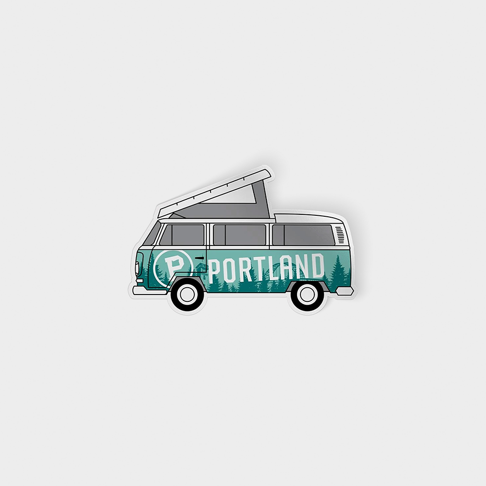 The "Bus Sticker" features an illustrated retro VW Westfalia camper van with a pop-up roof. The van, primarily green and white with black wheels, has "Portland" written in white lettering on its side against a backdrop of green trees. This weather-resistant sticker comes in sustainable packaging.