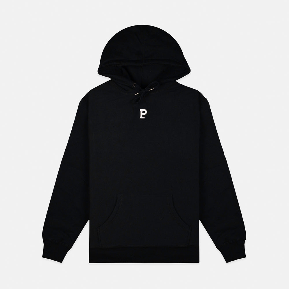 The HeavyKnit Centerpiece Hoodie - Black is a heavyweight hoodie with a front pocket and drawstring hood. It features a small, high-density white "P" logo embroidered on the chest and is packaged sustainably. The background is plain white.