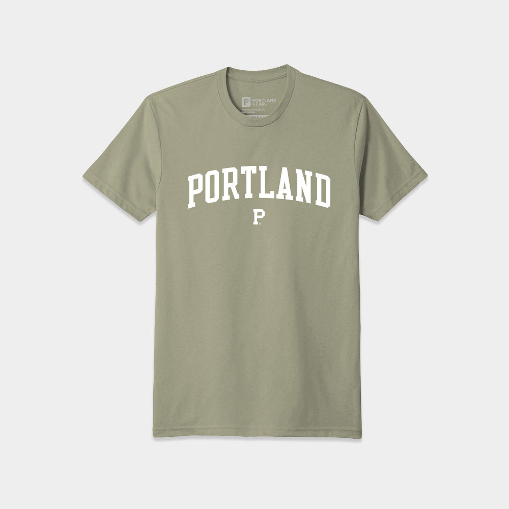 A green Soft-Blend Coastal Tee with the word "PORTLAND" printed in white, uppercase letters across the chest. Below "PORTLAND," there is a small white capital letter "P." The unisex t-shirt is laid flat on a light gray background and comes in sustainable packaging.