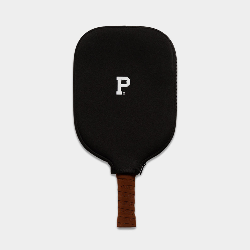 A limited edition black Pickleball Paddle with a brown grip is shown against a plain background. This paddle features a minimalist design, highlighted by a stylized white "P" from Portland Gear printed at its center.